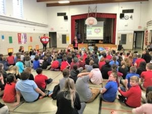 Children gather for a school assembly